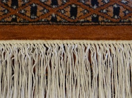 After repair of the fringes on an oriental carpet